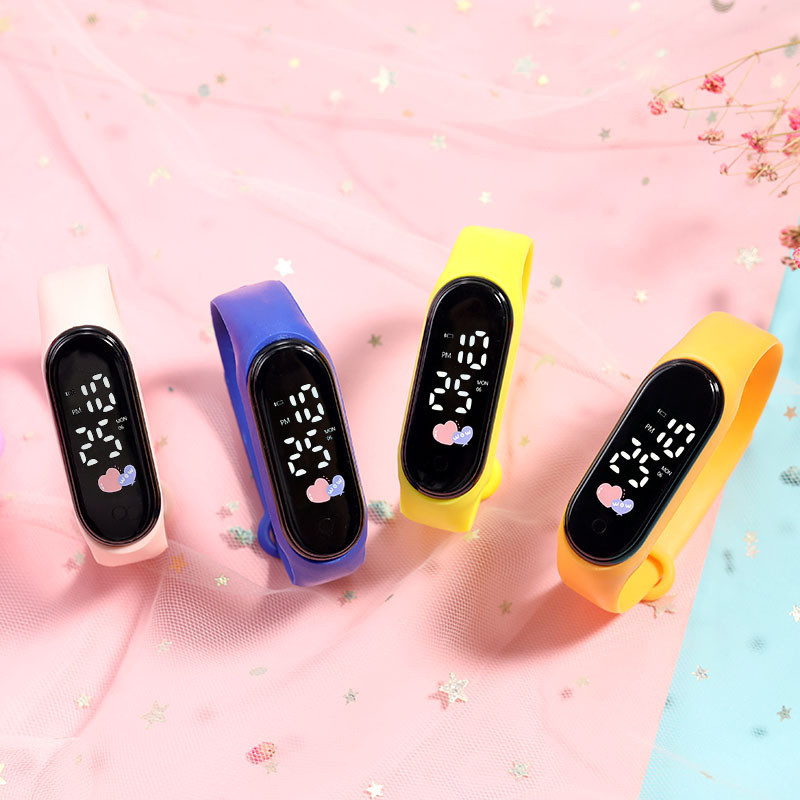 ผู้ชายผู้หญิงนาฬิกาดิจิตอล50เมตรน้ําต้านทาน นํา หัวใจรูปไข่หน้าปัดสายพลาสติกนักเรียนเด็กสาวแฟชั่นร้อนสบายๆกีฬานาฬิกาข้อมือ