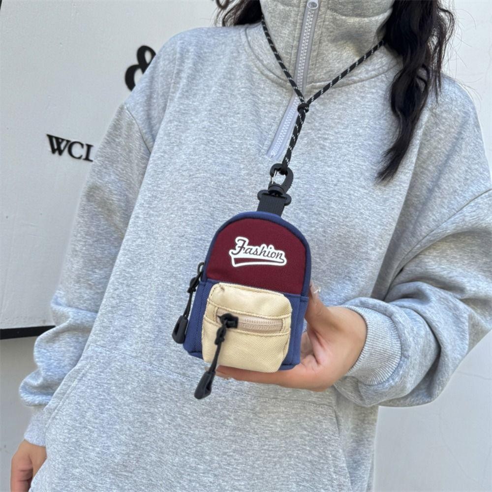 กระเป๋าใส่เหรียญแบบแขวนกระเป๋าสตางค์ขนาดเล็กกันขโมยโพลีเอสเตอร์กระเป๋าเก็บหูฟังขนาดเล็กสีตัดกันน่ารัก - รูปที่ 3