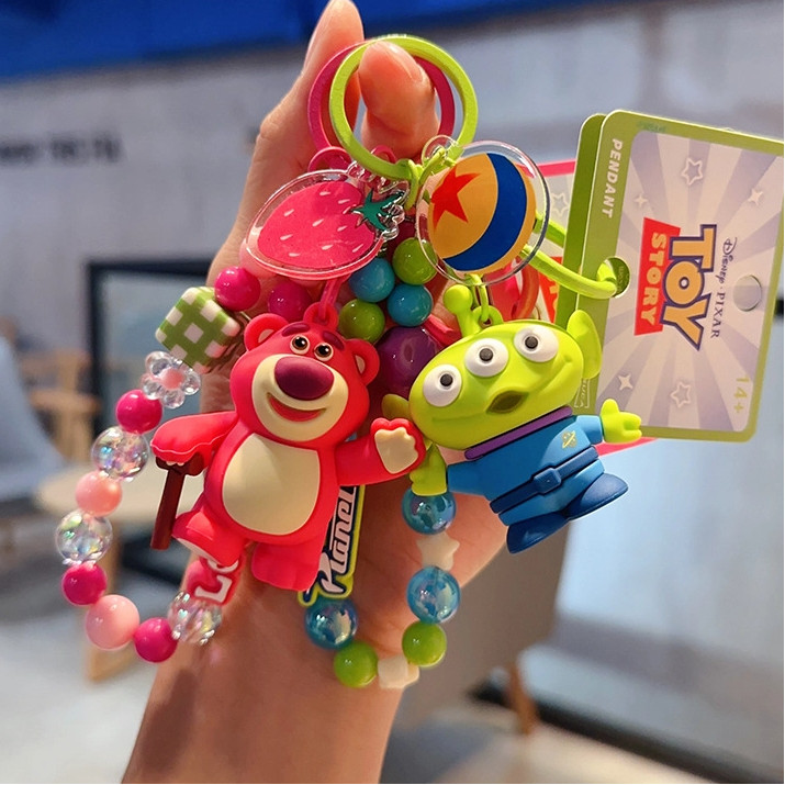 ของแท้ทอยสตอรี่สามตาเด็กชายสตรอเบอร์รี่หมีพวงกุญแจ/สร้างสรรค์อะนิเมะตุ๊กตากระเป๋านักเรียนจี้ของขวัญขนาดเล็ก