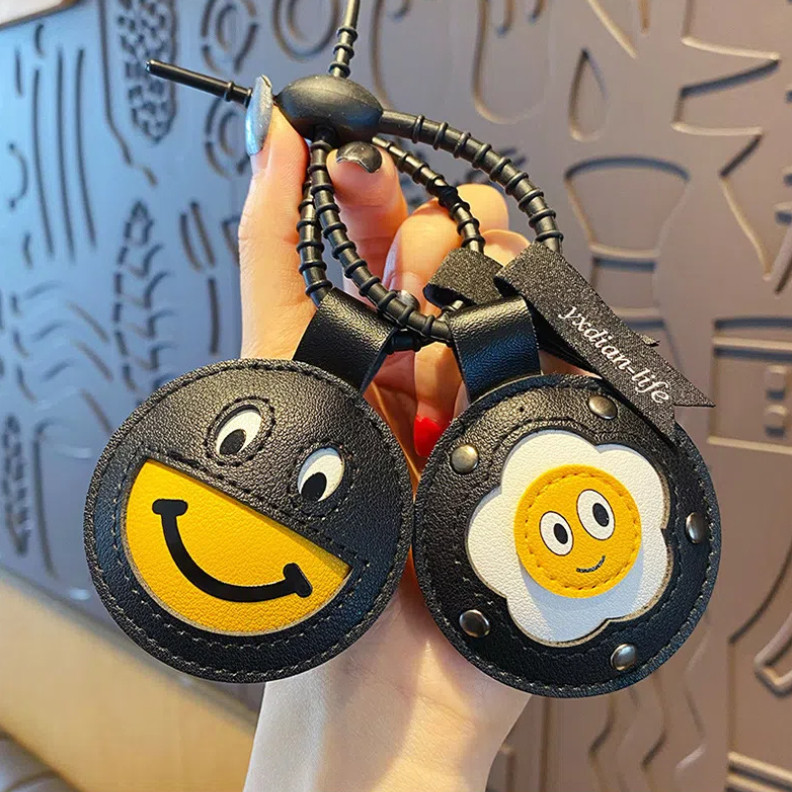 หนังหน้ายิ้มไข่ตุ๋นจี้พวงกุญแจที่ไม่ซ้ํากันสร้างสรรค์ผู้ชายผู้หญิงกระเป๋ากุญแจโซ่จี้จี้เครื่องประดับผู้หญิง