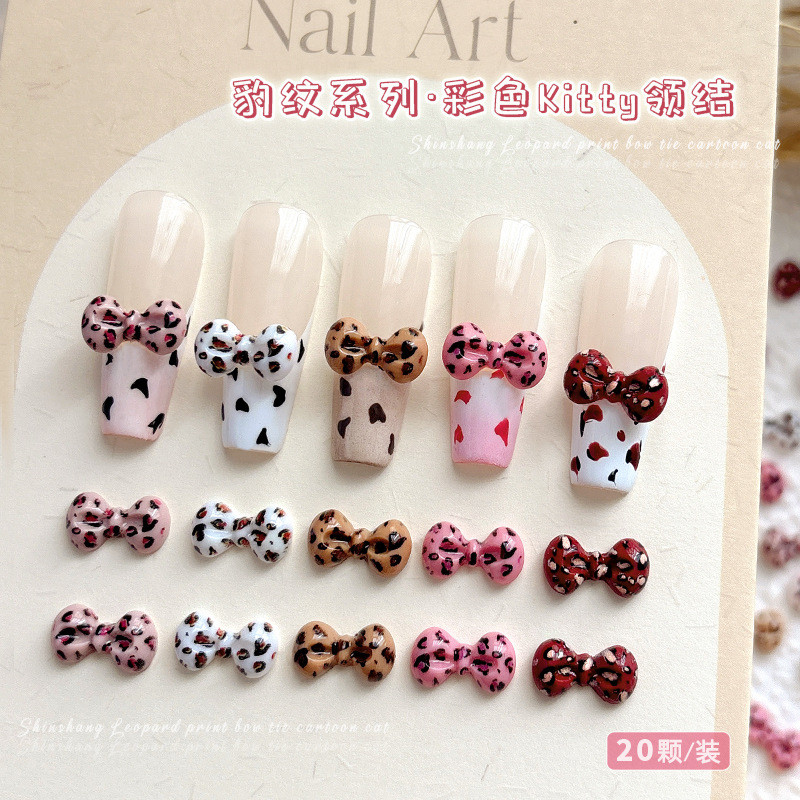 โบว์ผูกลายเสือดาว20ชิ้นคิตตี้แมวการ์ตูนเครื่องประดับเล็บน่ารักโบว์ DIY เล็บเพชร