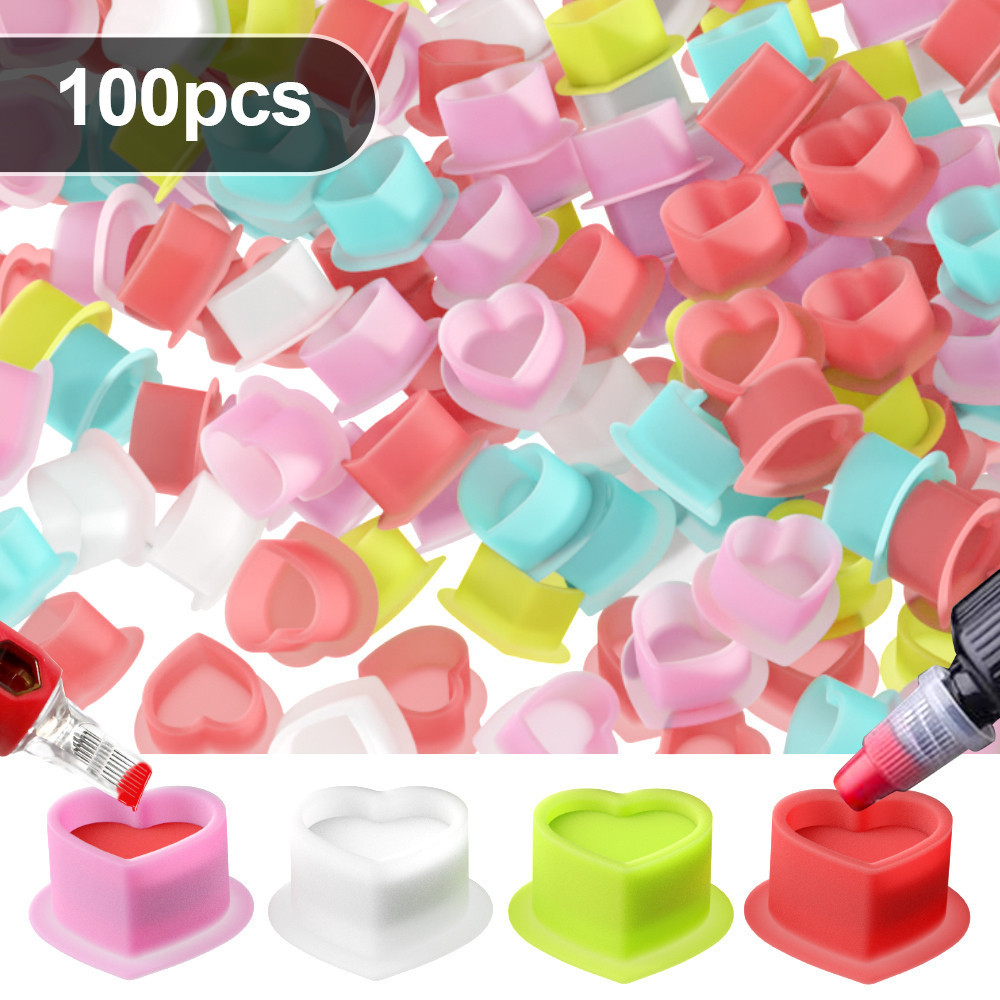 ซิลิโคนรูปหัวใจสักหมึกถ้วยน้ํา100ชิ้นทิ้งแต่งหน้าถาวรผู้ถือเม็ดสีคอนเทนเนอร์หมวกหมึกสักศิลปินอุปกรณ์เสริม