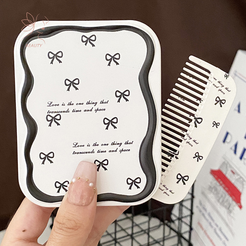[maybeauty] การ์ตูนน่ารัก Bowknot พับ Clam Mirror กระจกแต่งหน้าพร้อมหวีแบบพกพา Creative สําหรับผู้หญิงสาวกระจกมือถือ {TH}