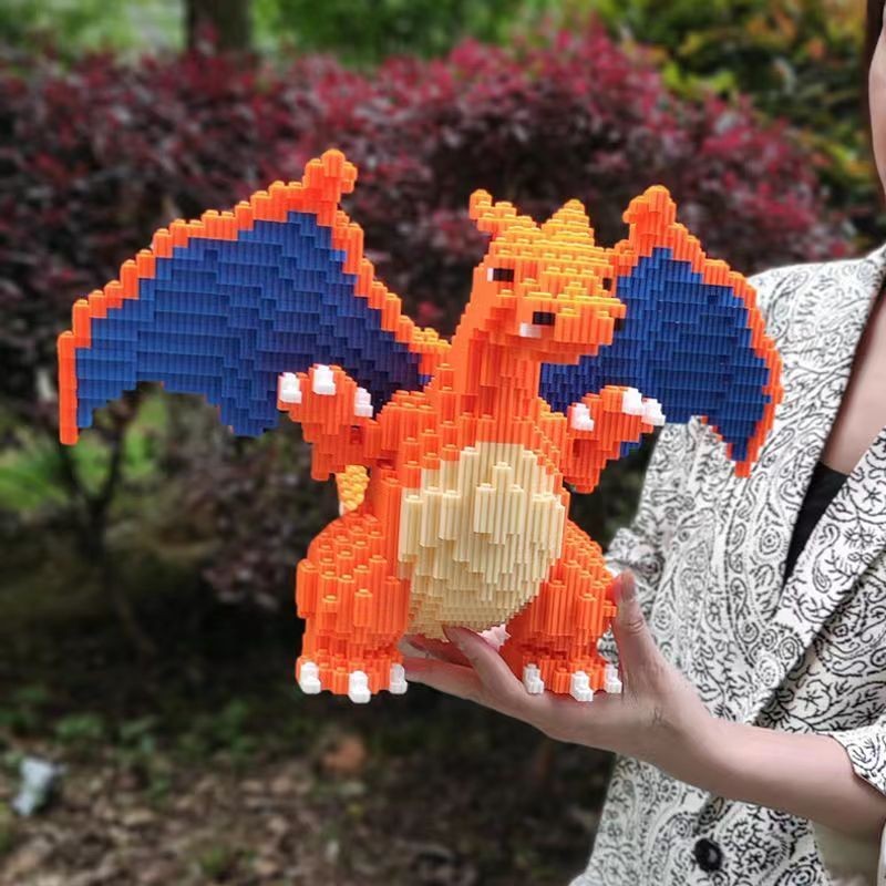 ใช้งานร่วมกับเลโก้บล็อกตัวต่อ Pokémon Charizard Fire-breathing Dragon เด็กประกอบ 3D สามมิติสติปัญญาของเล่นเด็กหญิงของขวัญวันเกิด Puzz