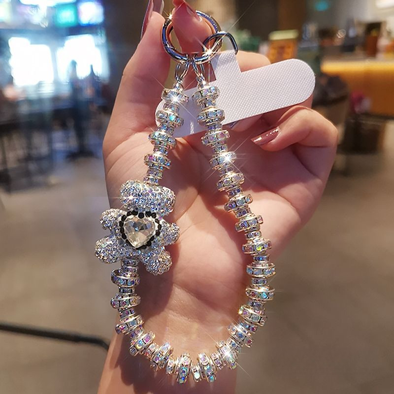 [พีดีเอ็ม] พลอยเทียม ระดับไฮเอนด์แขวนโซ่แฟชั่นเทพธิดาโทรศัพท์มือถือเชือกเส้นเล็กสไตล์สั้นข้อมือกระพริบจี้เพชรพร้อมเปลือกคลิปแข็งแรงกลางแจ้งป้องกันการสูญ