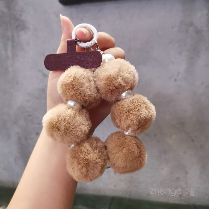 หรูหราหลากสีตุ๊กตามุกก้อนขนสายรัดข้อมือสร้อยข้อมือกรณีโทรศัพท์มือถือที่มีคลิปเชือกเส้นเล็กสั้นพวงกุญแจกระเป๋าจี้ช็อกหลักฐานและทนต่อการสูญ