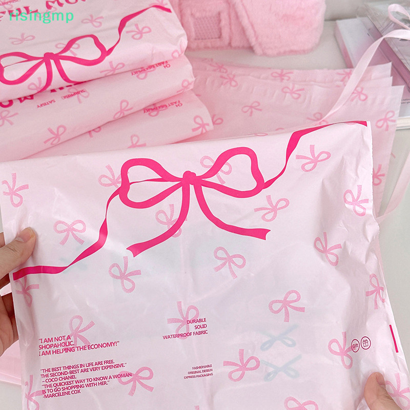 [risingmp] พลาสติกสีชมพู Courier กระเป๋าไปรษณีย์โบว์น่ารัก Prinitng เสื้อผ้า Mailer เก็บถุงบรรจุภัณฑ์ของขวัญรองเท้าขนส่งด่วนกระเป๋า