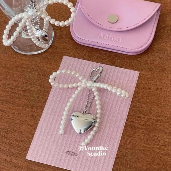 Steve เกาหลี Sweet Pearl Bowknot Silver Heart จี้พวงกุญแจชุดหูฟังบลูทูธจี้