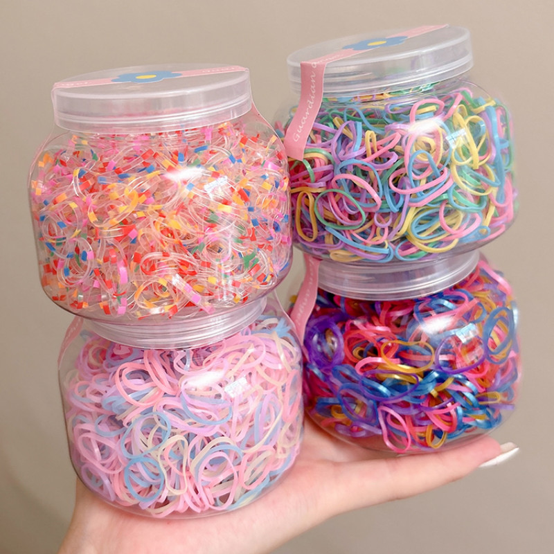 1000ชิ้นกระป๋องเด็กที่มีสีสันไม่ฉมวกผูกผมสําหรับสาวๆน่ารักทิ้งยางรัดอุปกรณ์ผม
