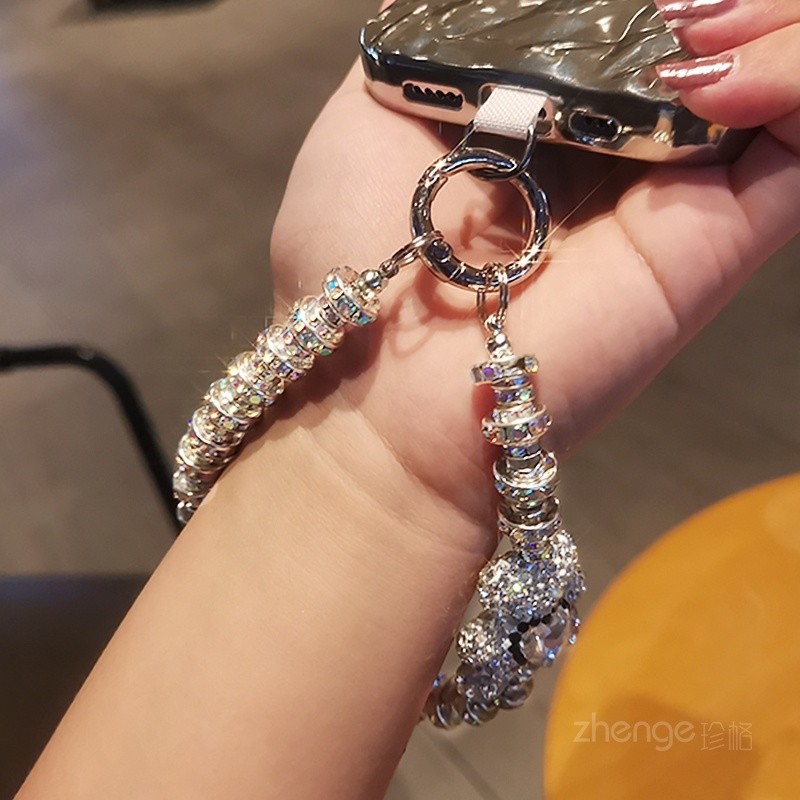 [พีดีเอ็ม] พลอยเทียม ระดับไฮเอนด์แขวนโซ่แฟชั่นเทพธิดาโทรศัพท์มือถือเชือกเส้นเล็กสไตล์สั้นข้อมือกระพริบจี้เพชรพร้อมเปลือกคลิปแข็งแรงกลางแจ้งป้องกันการสูญ