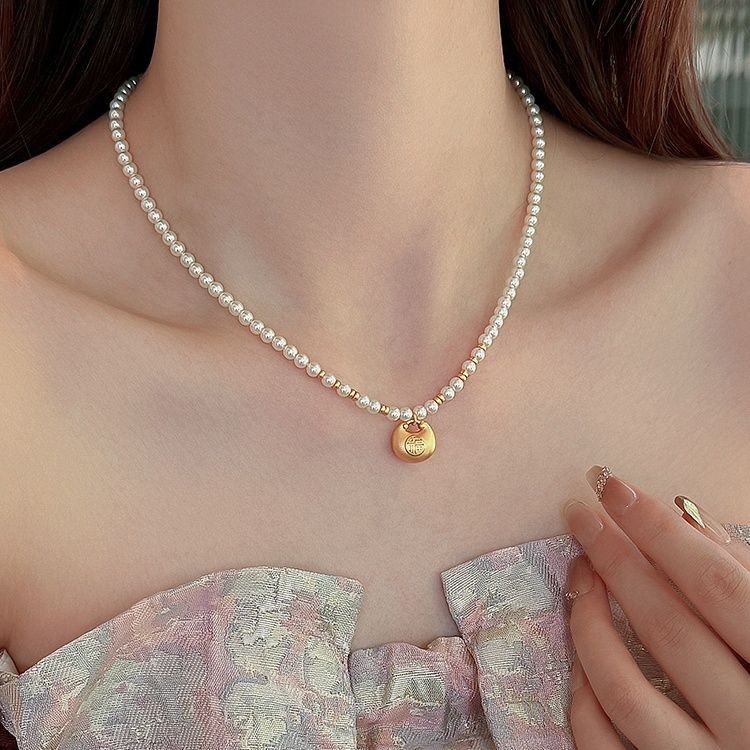 Shijia Xiaomi สร้อยคอมุกสําหรับจี้ถุงโชคดีสีทองของผู้หญิงโซ่กระดูกไหปลาร้าจีน niche high- oof 小米珠项链女