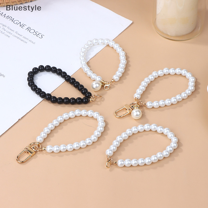 Bluestyle จําลอง Pearl พวงกุญแจหูฟังกระเป๋าจี้ข้อมือลูกปัด Key Holder Pearl Beaded สร้อยข้อมือพวงกุญแจผู้หญิงโทรศัพท์มือถือเครื่องประดับใหม่