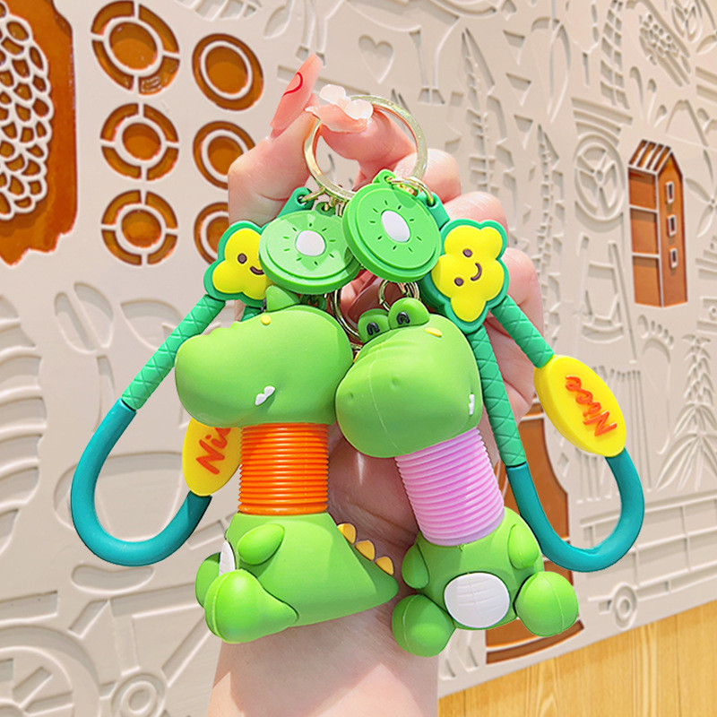 ผลไม้สนุกยืดไดโนเสาร์สัตว์ คาปิบาลา ตุ๊กตากระเป๋าเป้สะพายหลังพวงกุญแจจี้การ์ตูนกระเป๋าเป้สะพายหลังพวงกุญแจจี้อุปกรณ์