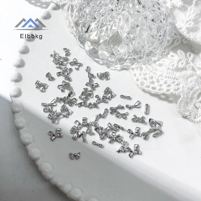 Eibbkg 50/100PCS เงินโลหะ Bows Nail Art Charm 3D โลหะผสมเงิน/ทอง Bowknot ริบบิ้นตกแต่งเล็บอะไหล่ DIY อุปกรณ์แต่งเล็บลดราคา