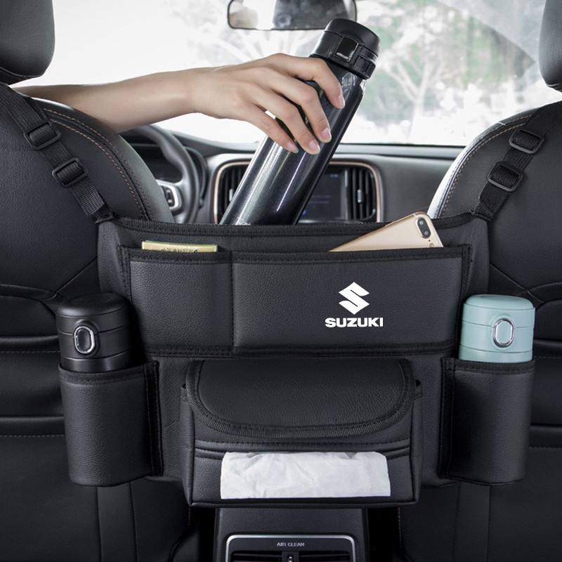 หนังรถที่นั่งกลางแขวนกระเป๋าสําหรับ Suzuki Swift Grand Vitara Jimny Ertiga SX4 Alto Ciaz Dzire APV S-Cross ระหว่างที่นั่งเนื้อเยื่อถ้วยน้ํากระเป๋าโทรศัพท์จัดเก็บ