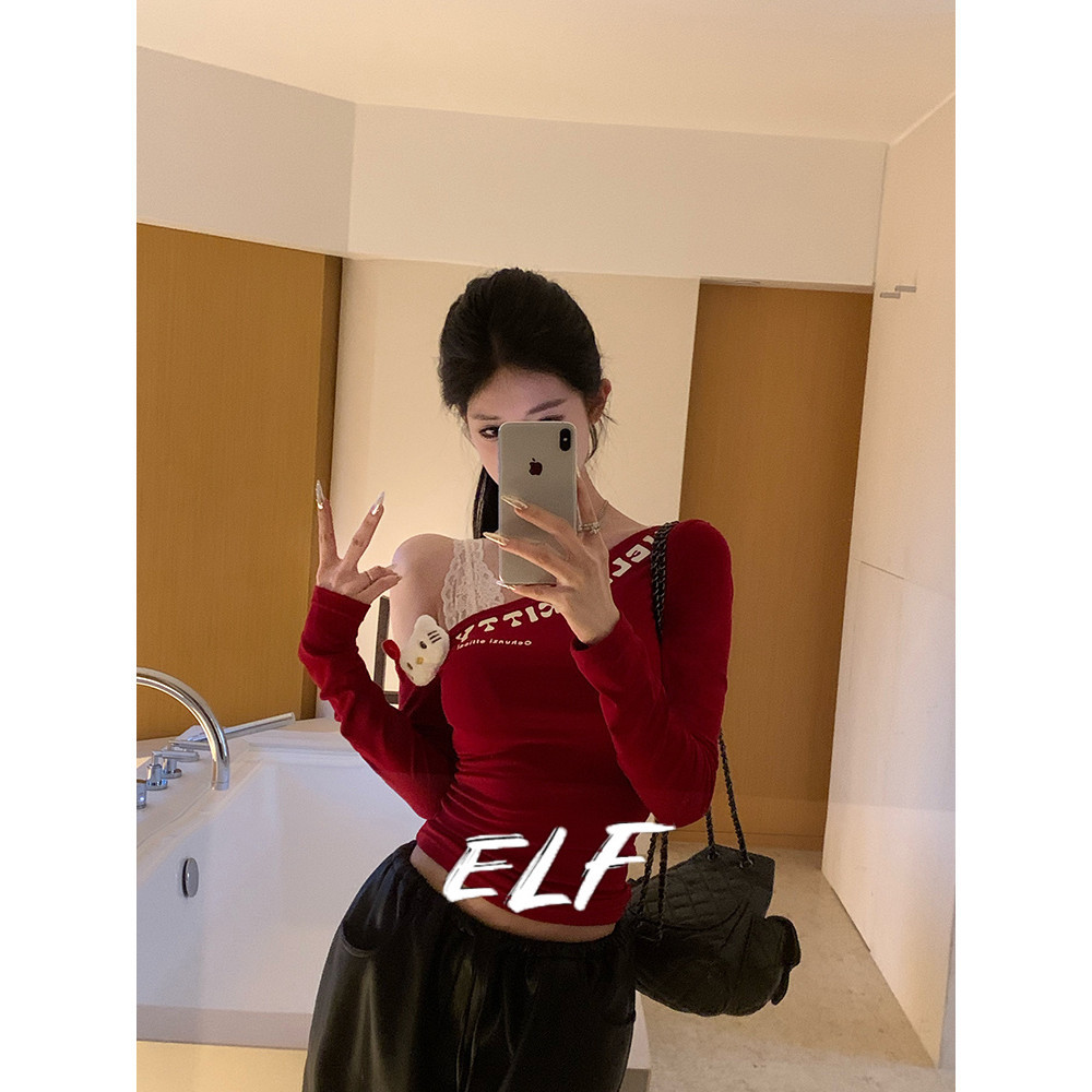 เสื้อยืดผู้หญิงแขนยาวและไหล่เส้นทแยงมุมที่มีรูปร่างสั้นด้วยดอกไม้พิมพ์กอดสาวร้อนบุคลิกภาพรุ่นฤดูใบไม้ร่วงใหม่