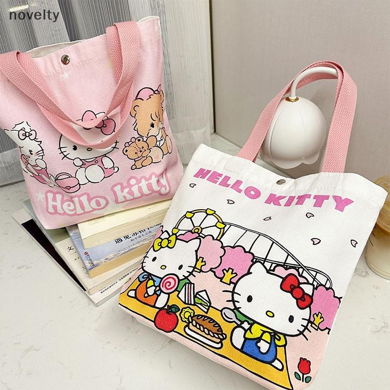 Nly การ์ตูน Hello Kitty ผ้าใบกระเป๋า Kawaii Sanrio กระเป๋าถือแบบพกพาขนาดใหญ่ความจุผู้หญิงช้อปปิ้งกระเป๋า N
