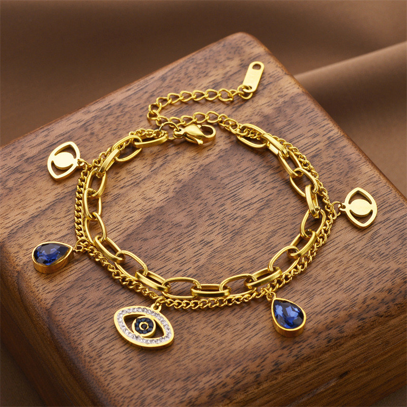 แฟชั่นยุโรปและอเมริกา Devil Eye สร้อยข้อมือสองชั้นเหล็กไทเทเนียมไม่ซีดจางข้ามพรมแดนขายร้อนสร้อยข้อมือผู้หญิงที่เรียบง่ายและหรูหราเครื่องประดับ