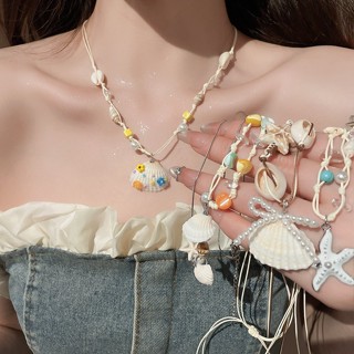 สร้อยคอน่ารักสไตล์วันหยุด ทำจากเชลล์และเชือกขี้ผึ้ง มีลายปลา…