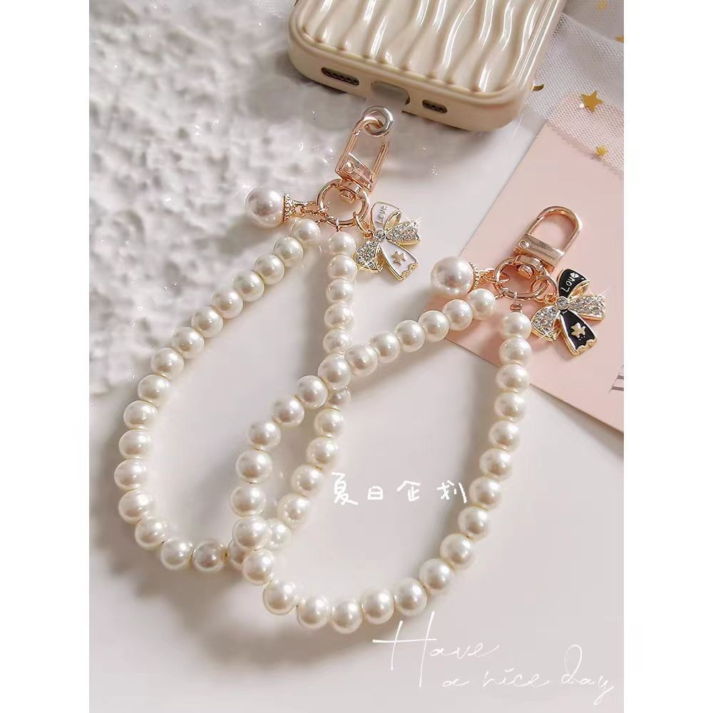 ใหม่โทรศัพท์มือถือเชือกเส้นเล็กโบว์มุกสร้อยข้อมือผู้หญิง INS แฟชั่นเรียบง่ายสไตล์บูติกลูกปัดขนาดเล็กที่ทำด้วยมือ