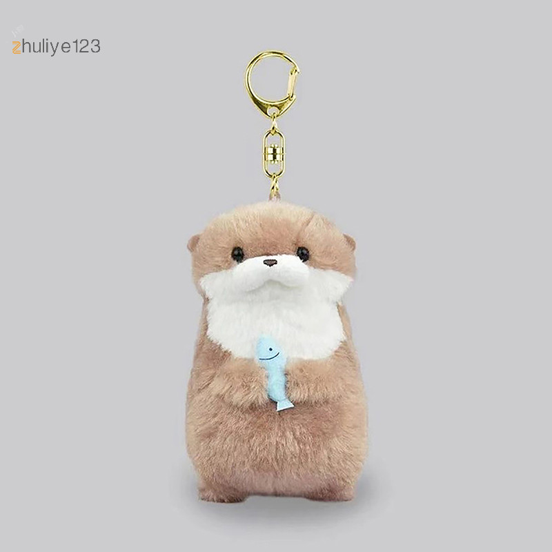 <zhuliye123> นากน่ารักถือปลาตุ๊กตาพวงกุญแจน้ําหนักเบาแขวนจี้ Props สําหรับกระเป๋านักเรียน Key กระเป๋าสตางค์ Nice