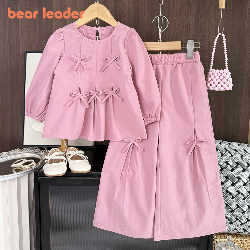 หมีผู้นําเวอร์ชั่นเกาหลีโบว์สีชมพูสาวเสื้อผ้าฤดูใบไม้ผลิฤดูใบไม้ร่วงแขนยาวเสื้อยืดด้านบน + กางเกงขากว้างชุดสองชิ้น