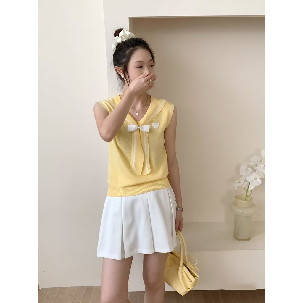 เสื้อกั๊กถักเฟิงฮวน สีเรียบพร้อมโบที่กระดุมหน้าสีนavy