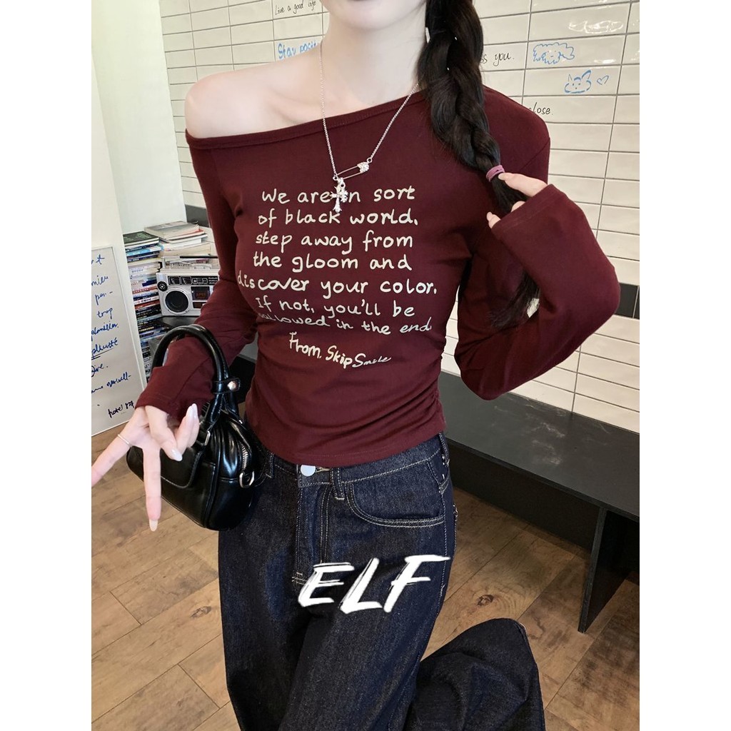 ELFwoo เสื้อยืดแขนยาวพิมพ์ลายดอกไม้ไหล่เฉียงสั้นสําหรับสาวฮอตออกแบบที่เหมาะสมรุ่นใหม่2024