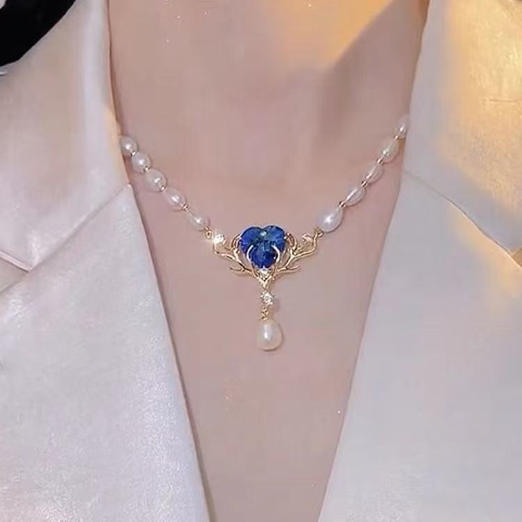 สไตล์แฟชั่นหรูหราระดับไฮเอนด์กวางหนึ่งที่มีหัวใจของมหาสมุทรสร้อยคอมุก Tamsui sho高质感 wolficle Trend o