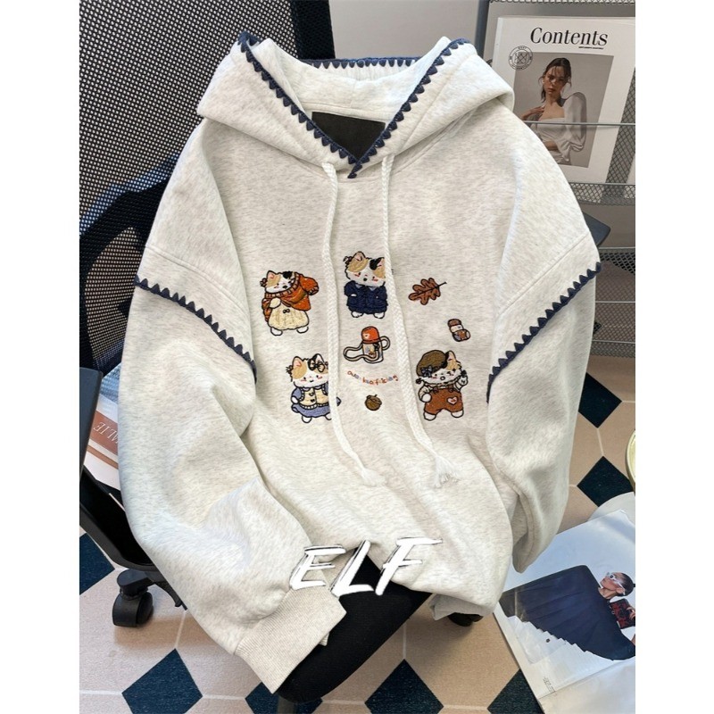 ELFwoo เสื้อฮู้ดแมวปักลายน่ารักสําหรับผู้หญิงฤดูใบไม้ผลิฤดูใบไม้ร่วงสไตล์หลวมและขี้เกียจสไตล์ตะวันตกเสื้อมีฮู้ดลดอายุ