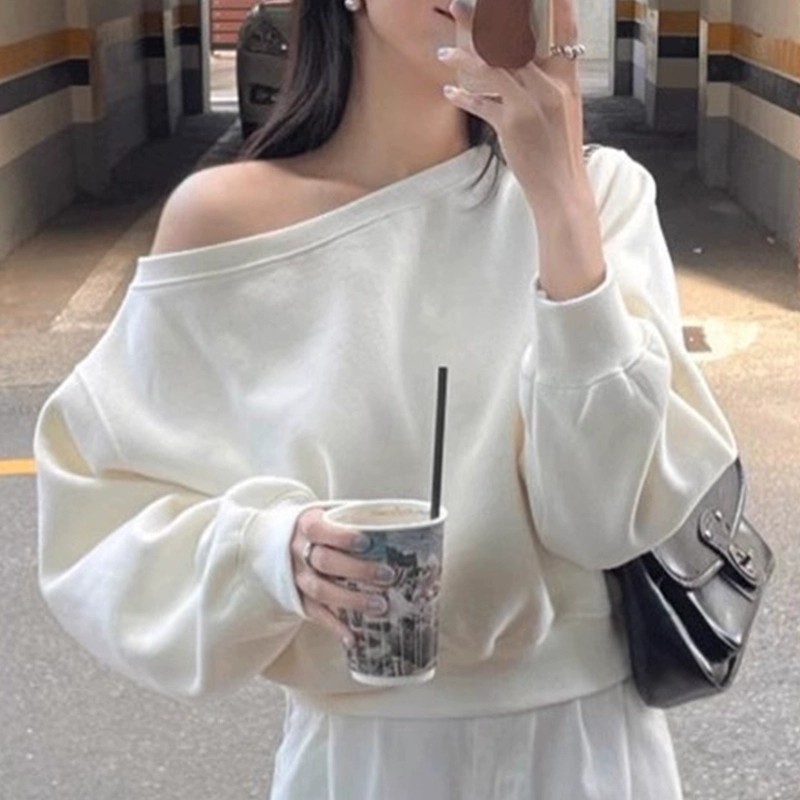 ฤดูใบไม้ร่วงใหม่เกาหลีรุ่นผู้หญิงสีทึบปิดไหล่หลวมสั้นอเนกประสงค์เสื้อแขนยาว 240906