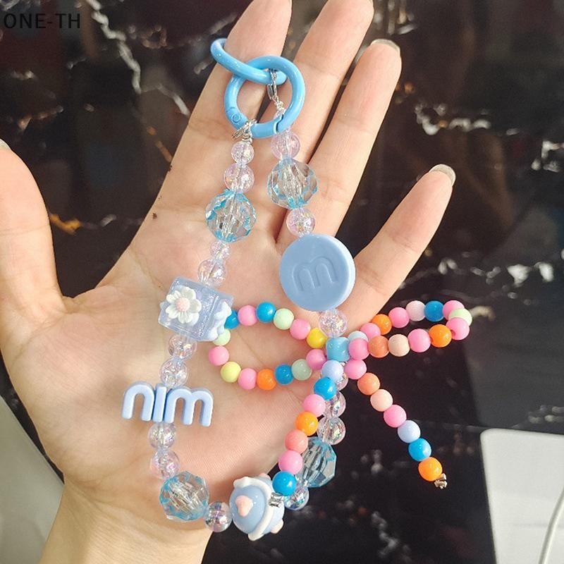 One-th ใหม่การ์ตูน Bubble Mart น่ารักเม็ดโซ่โทรศัพท์มือถือลูกปัด Hand-ed ลูกปัดโบว์พวงกุญแจจี้โทรศัพท์มือถือใหม่
