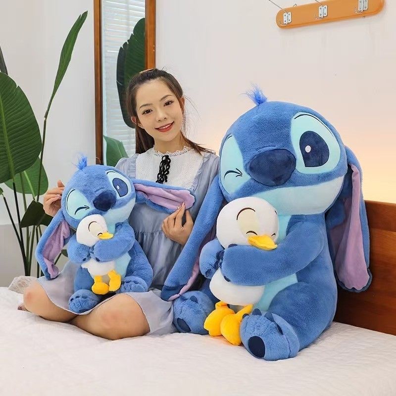 กอดเป็ดตุ๊กตาสติทช์ตุ๊กตาตุ๊กตาสติทช์ตุ๊กตาเครื่องจับเด็กหมอนของขวัญวันเกิดผู้หญิง