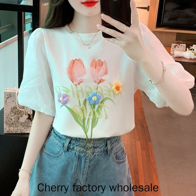 แฟชั่นผู้หญิงสไตล์ใหม่สีขาวพัฟแขนผ้าฝ้ายแท้แขนสั้นเสื้อยืดสามมิติดอกไม้อายุ @