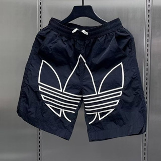 กางเกงกีฬาขาสั้นทรงหลวมสำหรับผู้ชาย ออกแบบทันสมัย เหมาะกับอา…