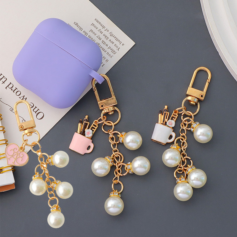 Elegant Pearl Charms Key แหวนเคลือบคอนเทนเนอร์ปากกา Pendnats แหวนแฟชั่น Shell Shape Key ผู้ถือกระเป๋าเครื่องประดับ