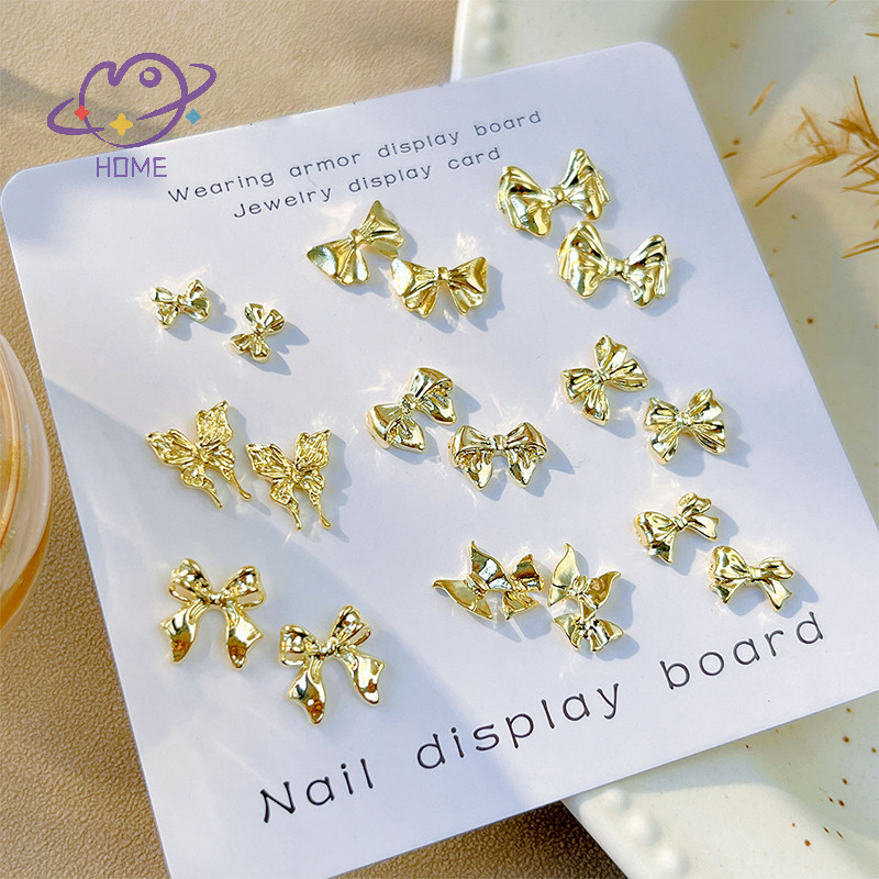 [mayhome] 10 ชิ้น 3D Bow Tie ริบบิ้นรูปเล็บอุปกรณ์เสริมทอง Multi-Designs เล็บเครื่องประดับ Rhinestones ตกแต่งเล็บ Charm {TH}
