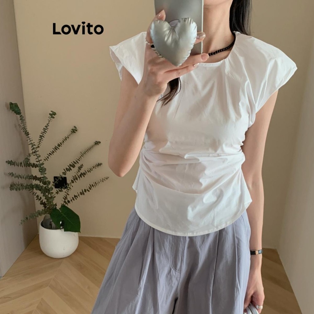 Lovito เสื้อเบลาส์ผู้หญิง ทรงอสมมาตร สีพื้น สไตล์ลำลอง LNM67137