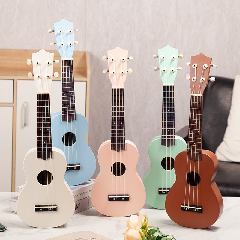 Ukulele Ukulele สามารถเล่นเครื่องดนตรีระดับเริ่มต้นกีตาร์ขนาดเล็ก Ukulele สีคาร์บอนไฟเบอร์21นิ้ว23