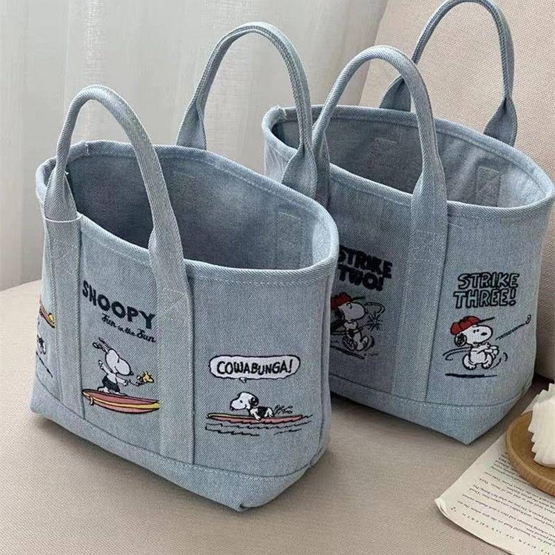 Snoopy เย็บปักถักร้อยวันกระเป๋าผ้าใบน่ารัก Baoma ออกไปถือกระเป๋าเบนโตะพนักงานออฟฟิศกระเป๋าถือผู้หญิง