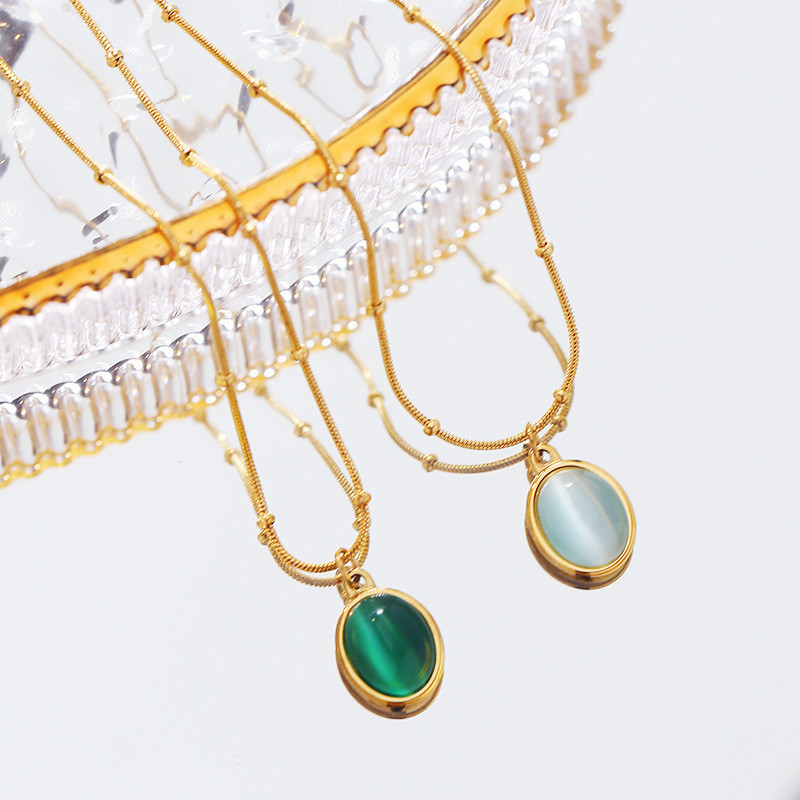 สไตล์ฝรั่งเศส Retro High-End Niche All-Match 18k Gold Clavicle Chain โอปอลรูปไข่จี้ไทเทเนียมเหล็กสร้อยคอผู้หญิง