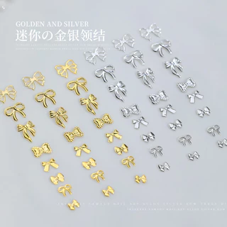 50 ชิ้น เครื่องประดับเล็บโบว์โลหะผสมคนดังทางอินเทอร์เน็ตสีทองสีเงินหรูหราเบาๆผูกโบว์กลวงริบบิ้นตกแต่งเล็บขายส่ง