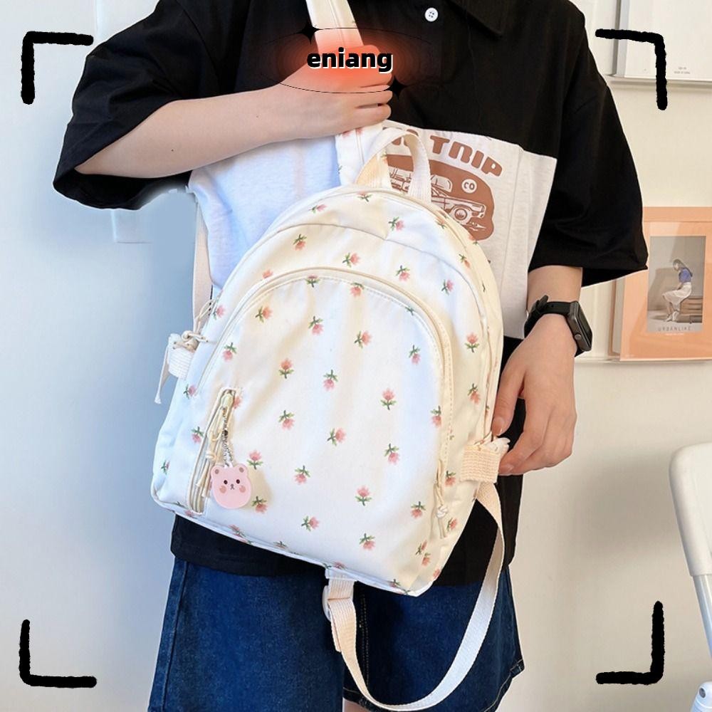 กระเป๋านักเรียนผ้าใบ พกพาสะดวก มีสายคล้องไหล่ปรับได้ และดีไซน์ลายดอกไม้สวยงาม