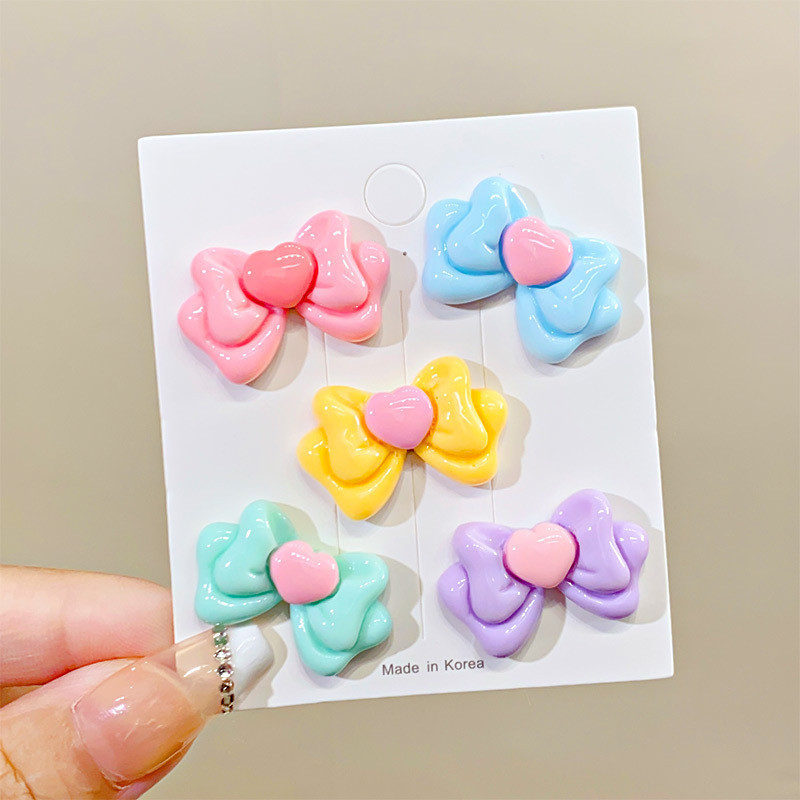 สีลูกกวาดรักโบว์เรซิ่นอุปกรณ์เสริมครีมกาว DIY อุปกรณ์ขายส่งเคสโทรศัพท์มือถือถ้วยน้ำแพทช์วัสดุ