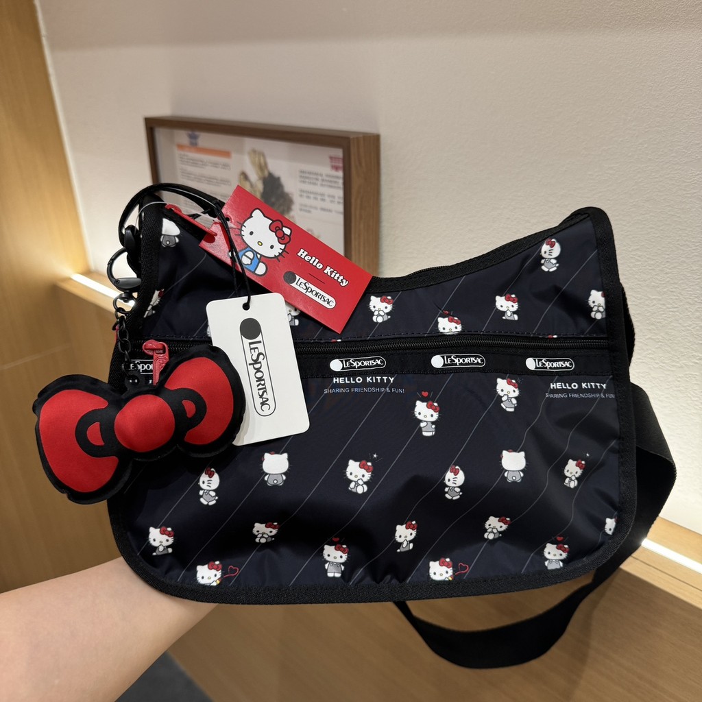 Hello Kitty กระเป๋าถือไหล่เดียวแฟชั่นกระเป๋าสะพายข้าง~พร้อมจี้โบว์+ที่เก็บกระเป๋าเดินทาง 7520
