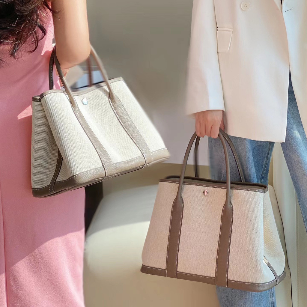 2021 ผ้าใบสไตล์ใหม่พร้อมหนังวัวชั้นแรกกระเป๋าหญิงกระเป๋าถือสวนหนังแท้สีตัดกันไหล่เดียวMe