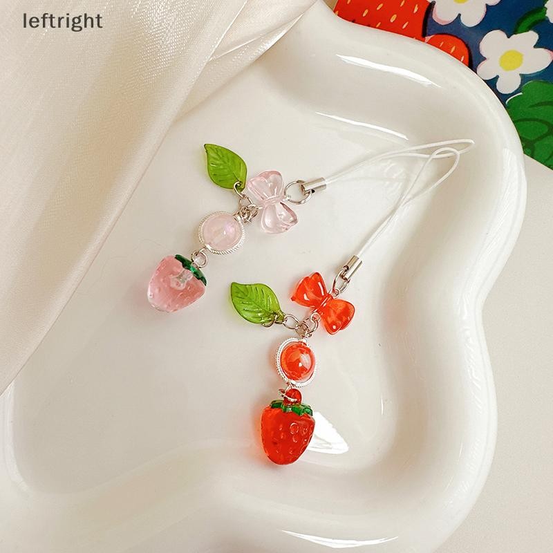 ซ้าย 1ชิ้นสีแดงเชอร์รี่สตรอเบอร์รี่โบว์สายคล้องโทรศัพท์มือถือเสน่ห์พวงกุญแจสําหรับสาวผู้หญิงกระเป๋ากล้องจี้หวานโทรศัพท์มือถือเครื่องประดับ GHT