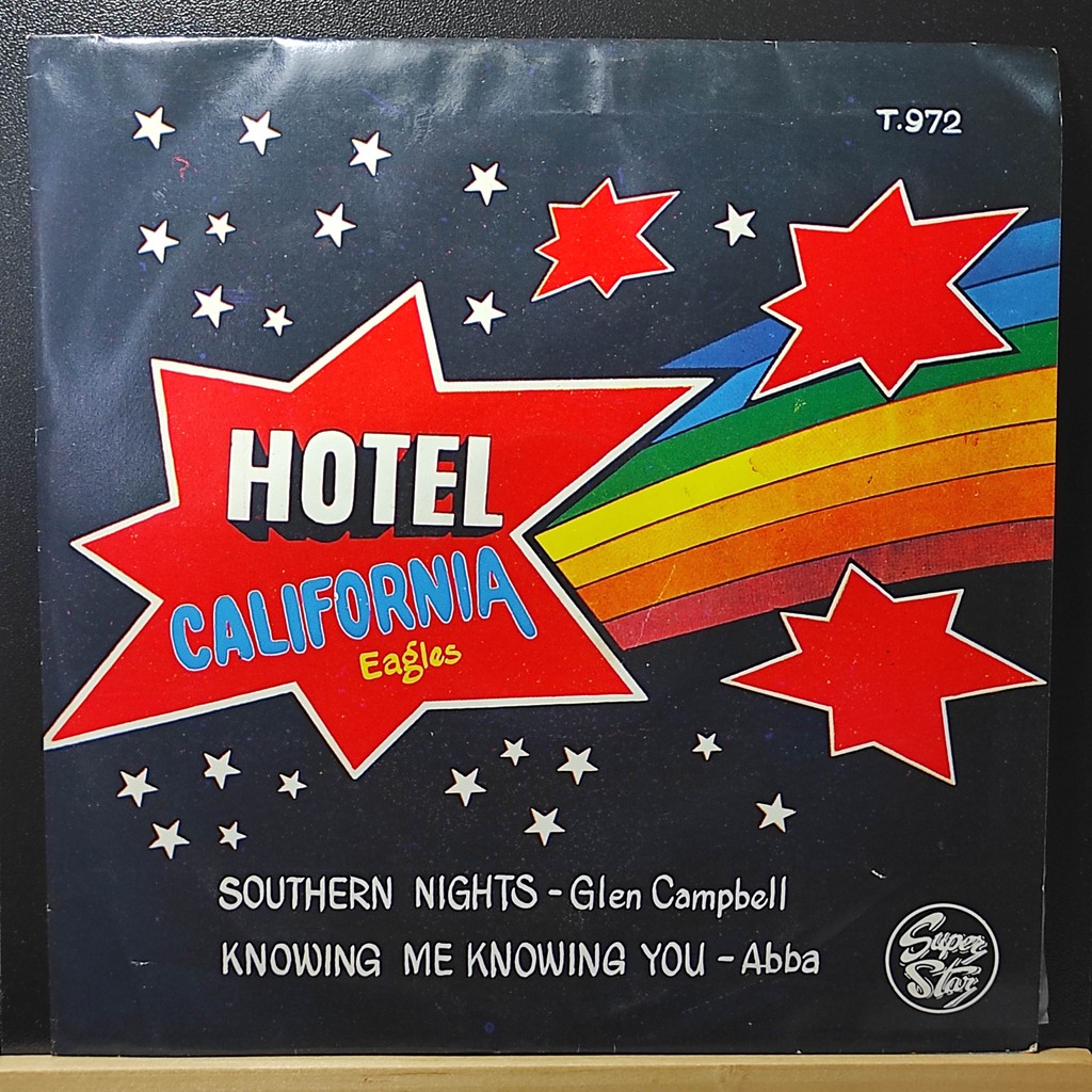 แผ่นเสียง7นิ้ว Hotel California Eagles /Knowing Me Knowing You – ABBA + ปกNM/แผ่นNM 45RPM รวมฮิต70s