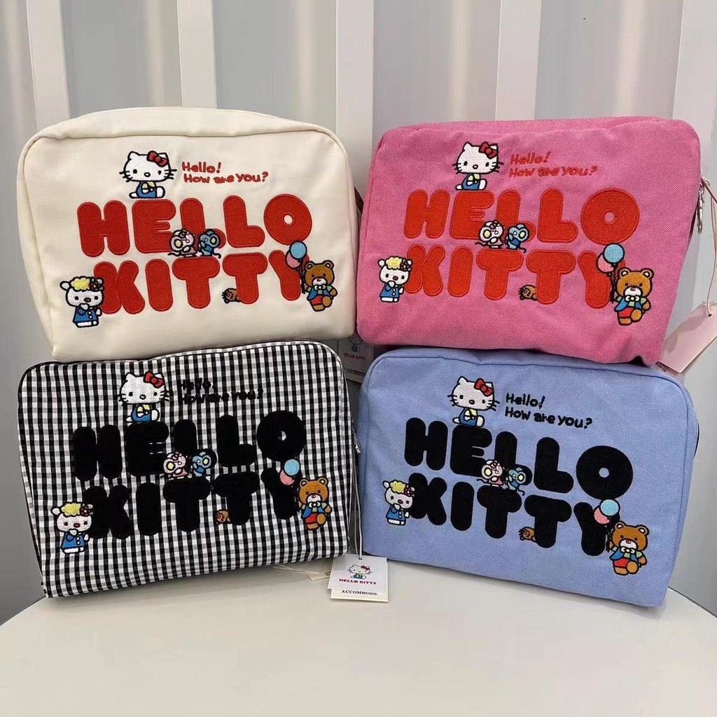 LeSportsac  เลสปอร์ตแซค สไตล์ใหม่ คิตตี้ การ์ตูนปักกระเป๋าหญิง/กระเป๋าเก็บแต่งหน้ากระเป๋าคลัทช์ 7121