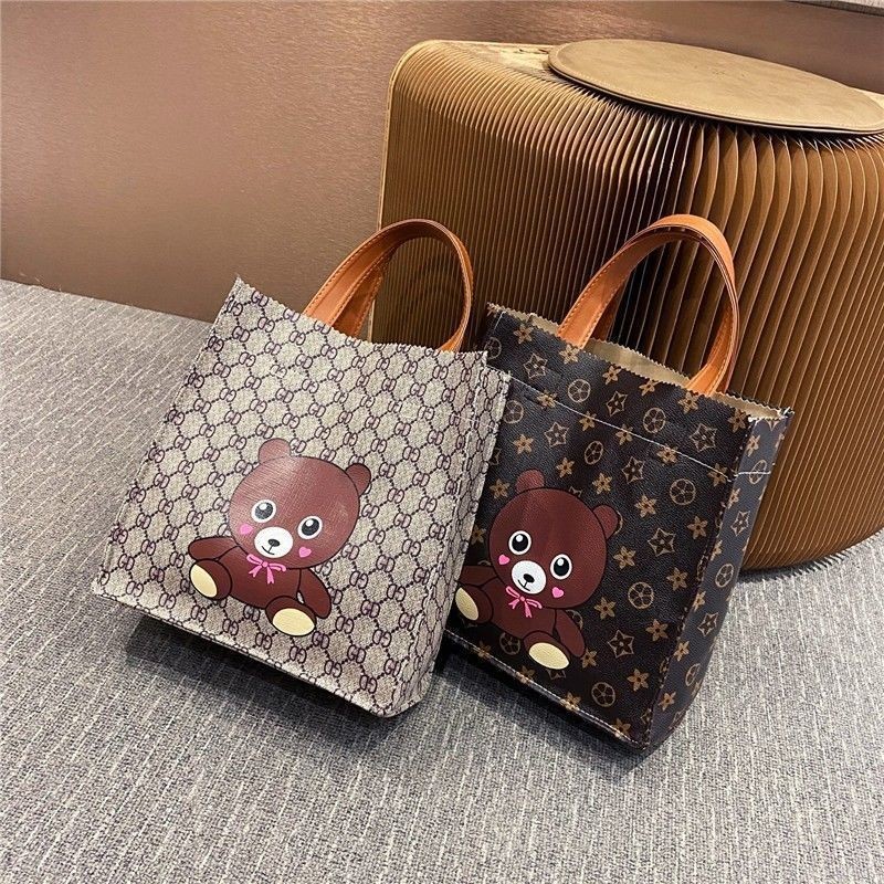 สไตล์ใหม่ Influencer การ์ตูนเปิดกระเป๋าถือแฟชั่น Mommy นักเรียน Bento Hand-Carry Outing ไหล่ ของเล่